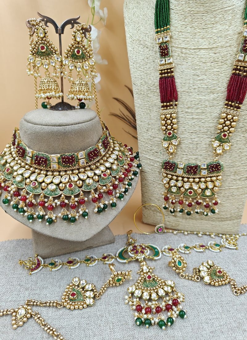 Beautiful gold plated alloy necklace set in maroon