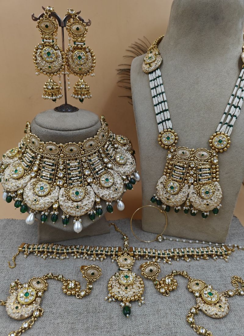 Beautiful gold plated necklace set in white