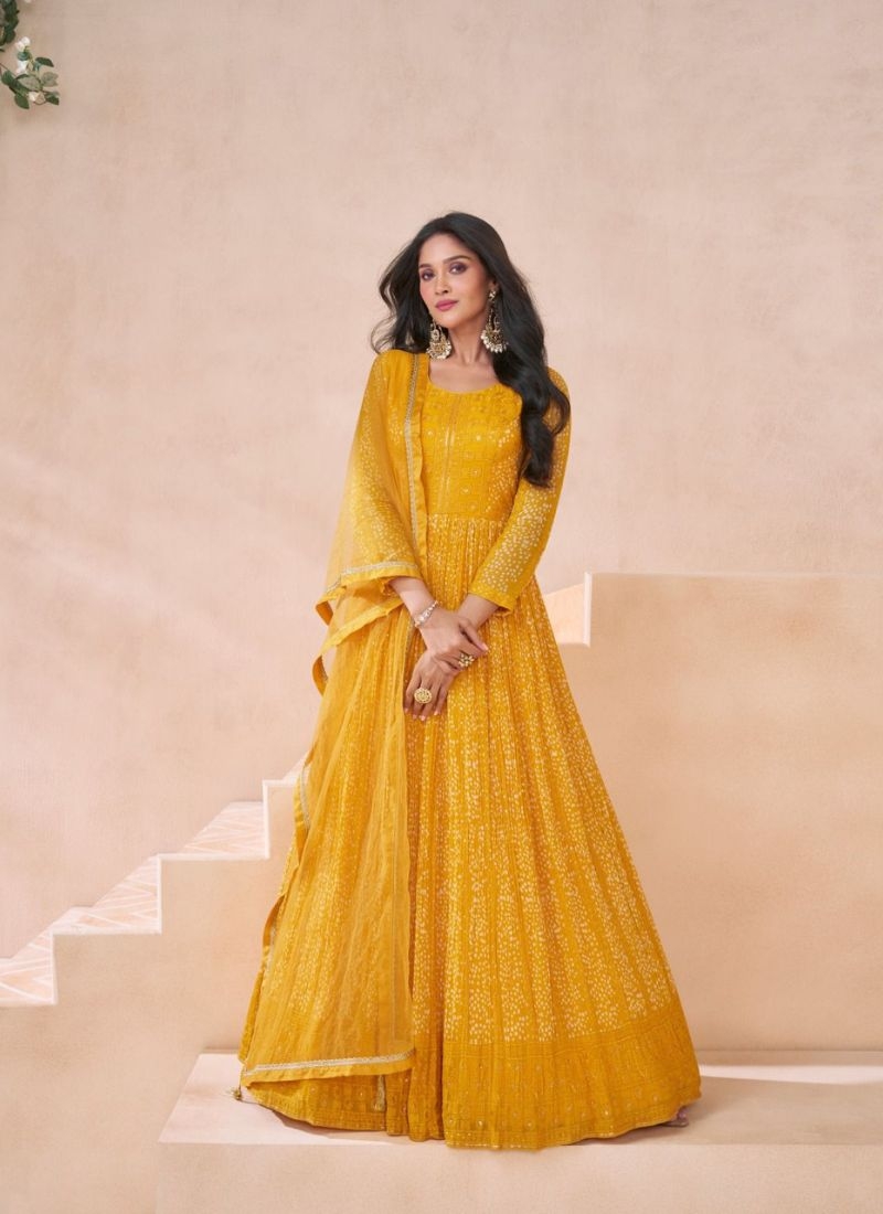 Trendy embroidered anarkali suit with net dupatta in yellow