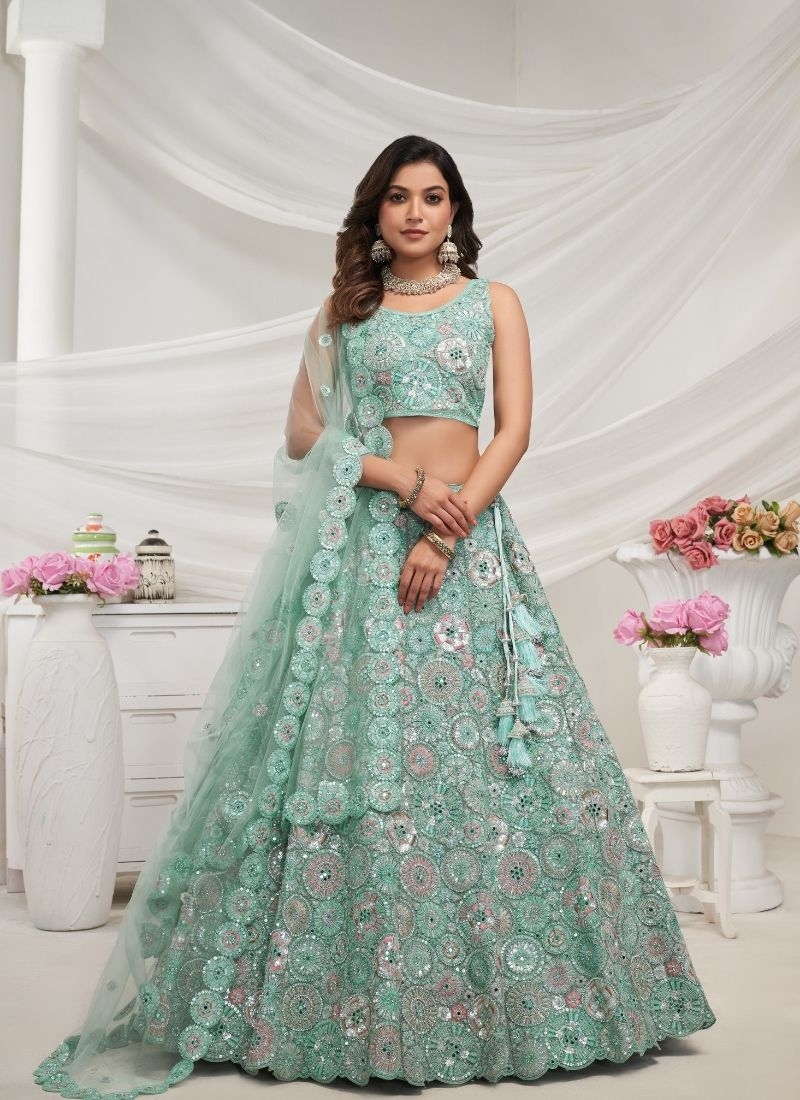 Stunning Sapphire Blue lehenga well crafted floral embellishments in green