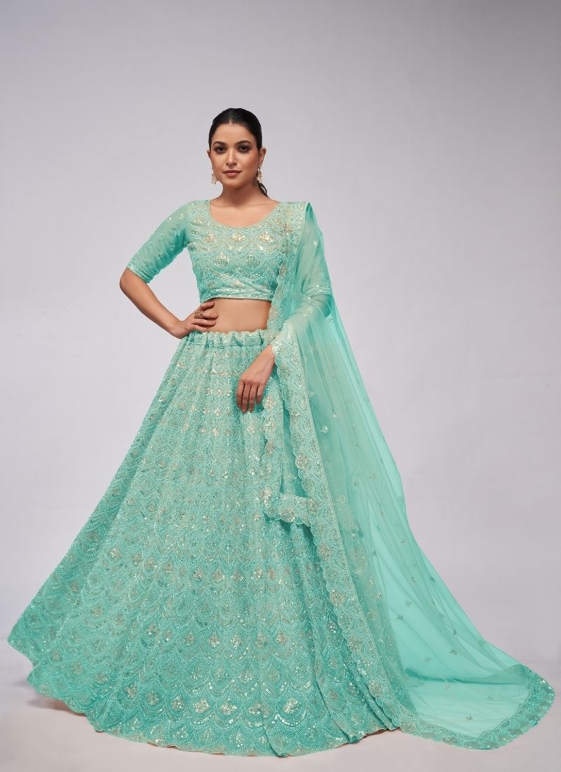 The dazzling lehenga is perfect for the contemporary bride. in green