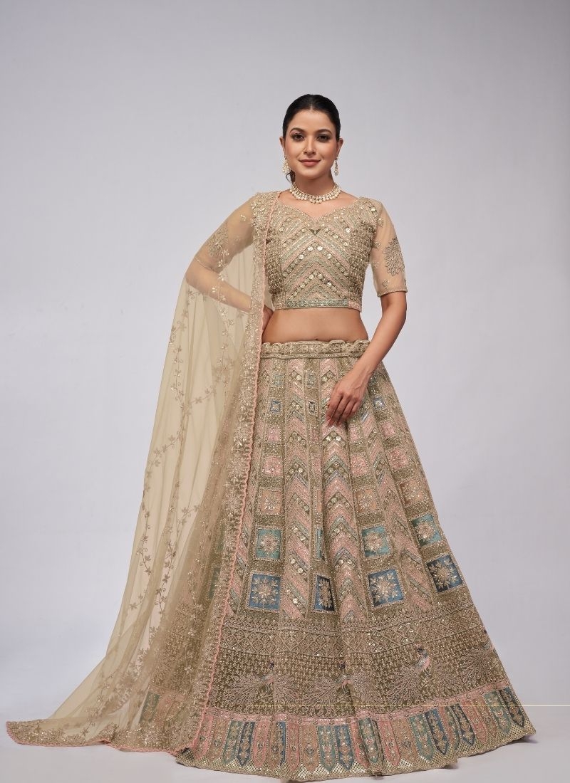 Beautiful patterns  zari embroidery in peacock and paisley motifs perfect bridal  lehenga in beige