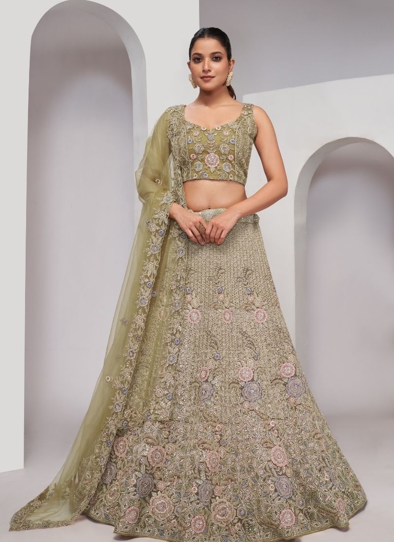 Beautiful patterns  zari embroidery in peacock and paisley motifs perfect bridal  lehenga in green