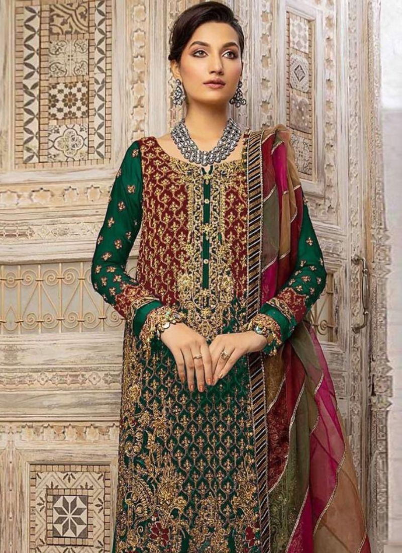 Beautiful embroidered georgette palazzo suit in dark green