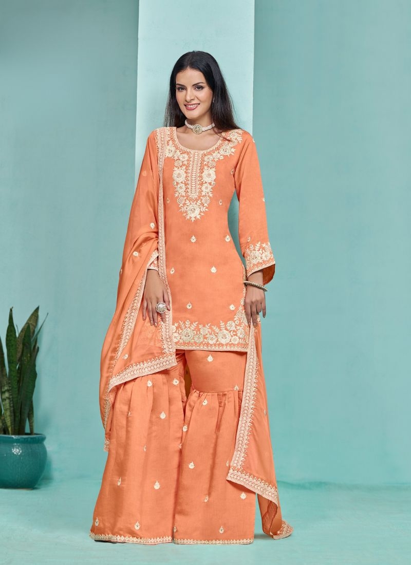 Stunning heavy embroidered sharara suit in orange