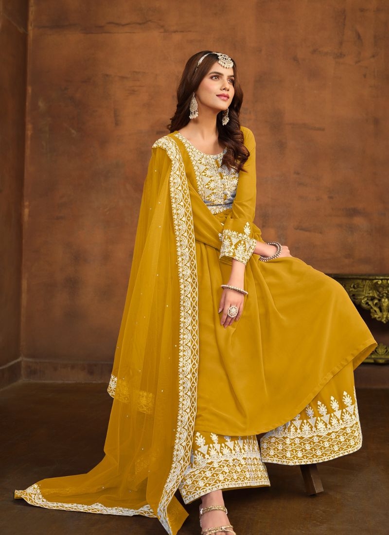 Beautiful embroidered faux georgette palazzo suit in yellow