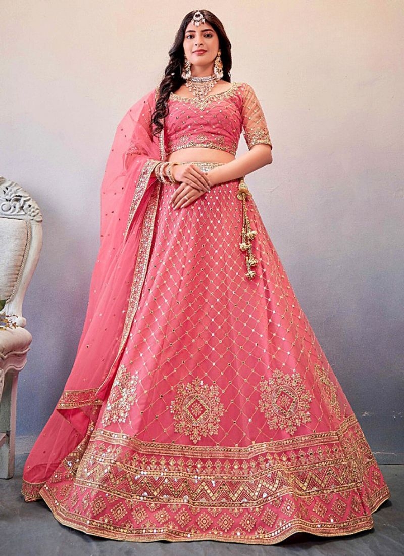 Exquisite thread embroidered net lehenga choli in peach pink