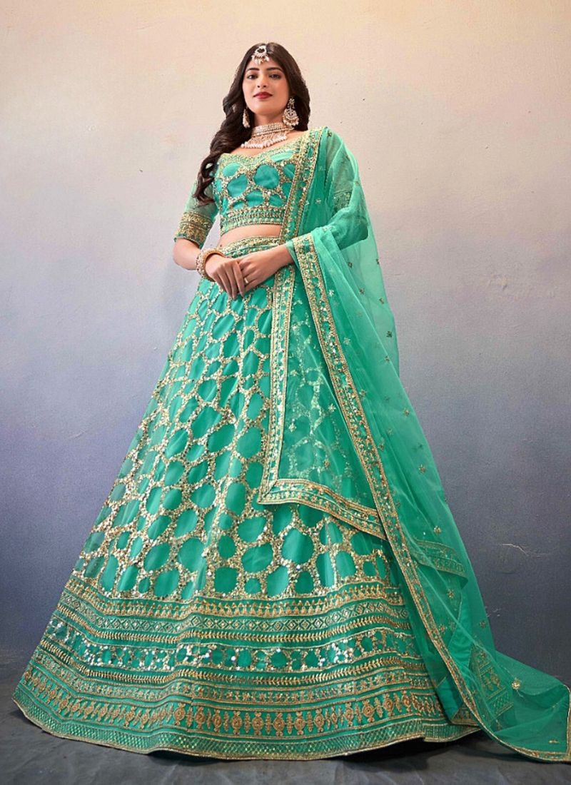 Exquisite thread embroidered net lehenga choli in green