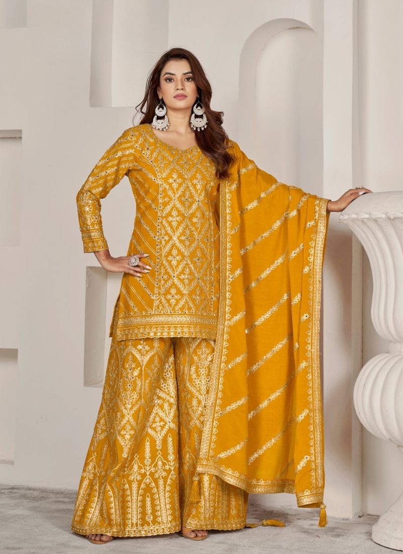 Exquisite heavy embroidered Chinon sharara suit in yellow