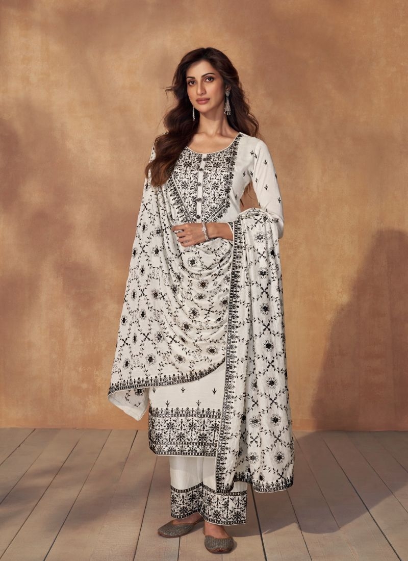 Beautiful thread embroidered silk kurta pant suit in white