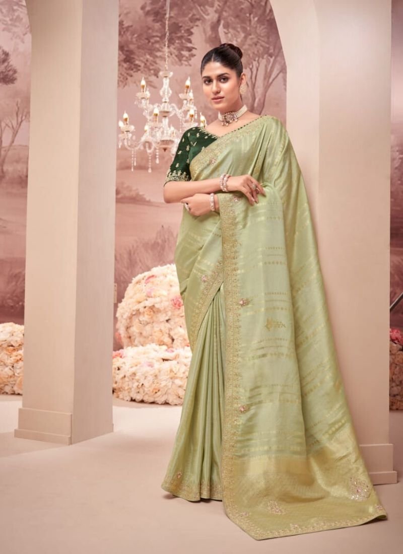 Beautiful mirror embroidered organza silk saree in green