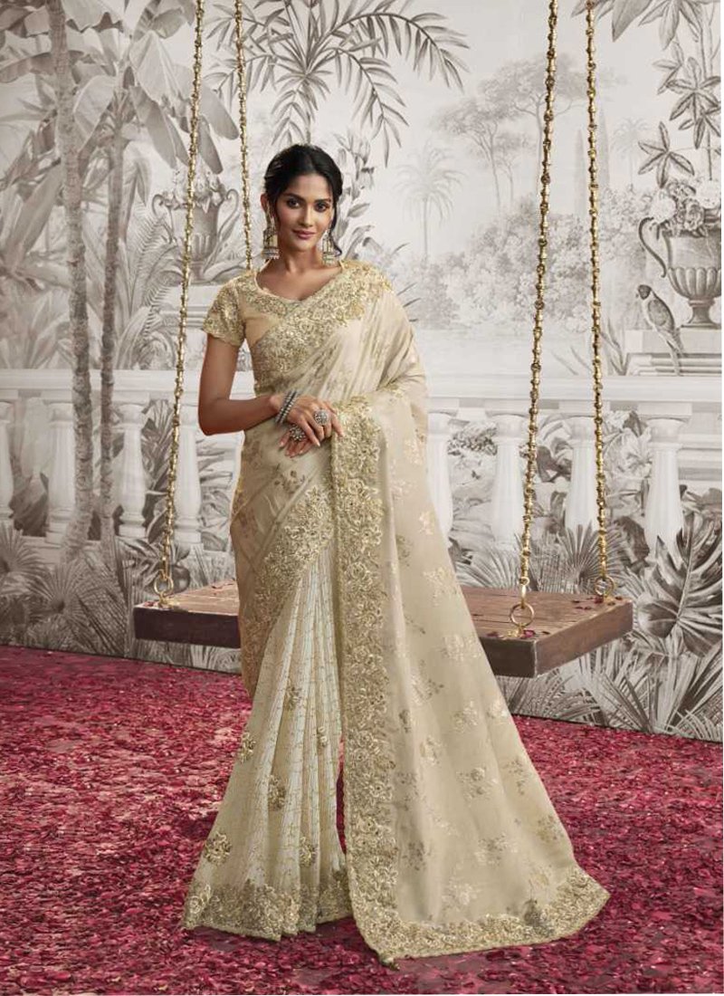 Beautiful embroidered georgette saree in cream