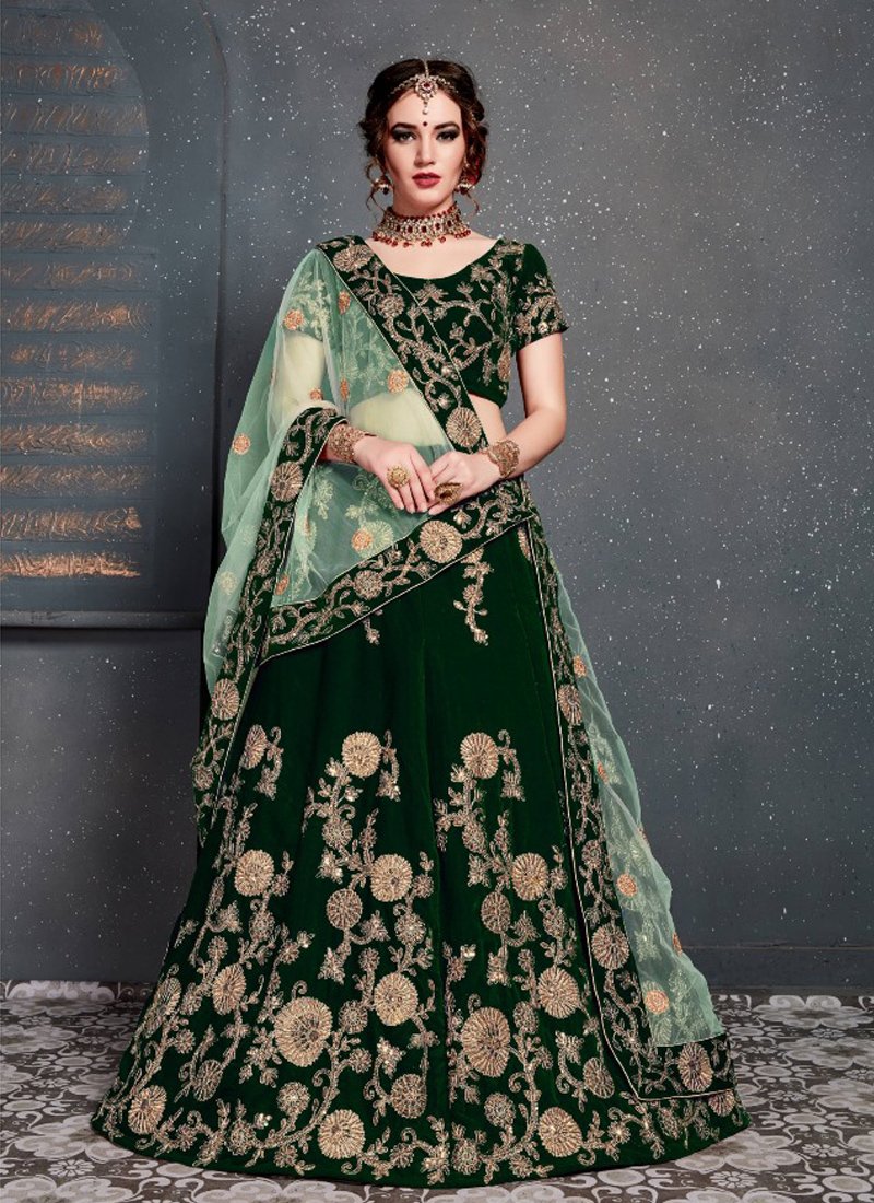 Beautiful embroidered velvet lehenga in dark green