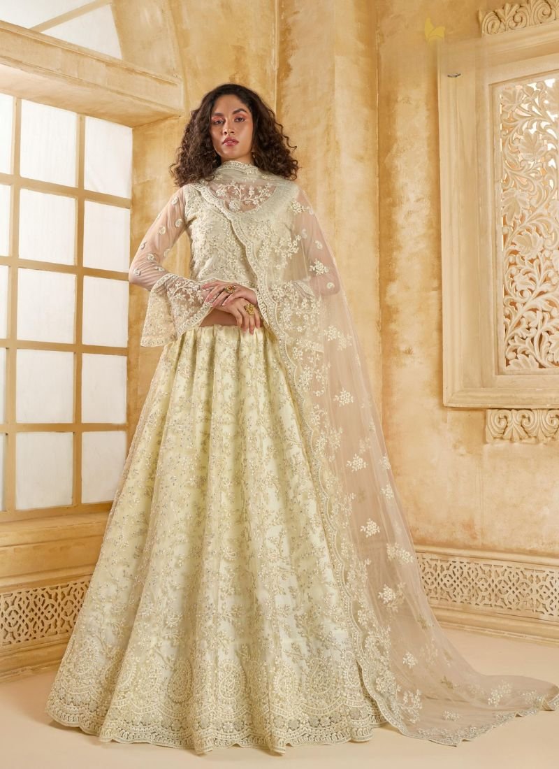 Trendy thread embroidered net lehenga in off white