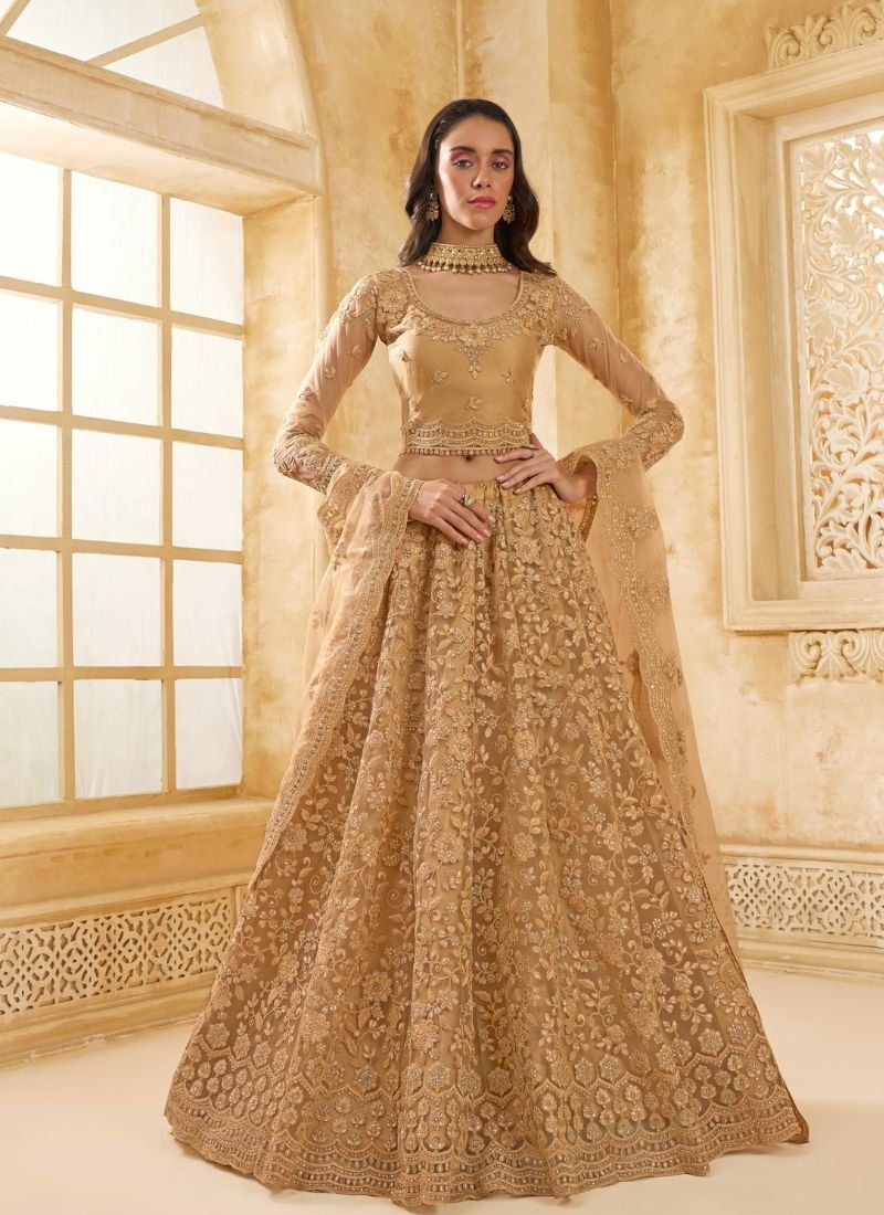 Trendy thread embroidered net lehenga in mustard