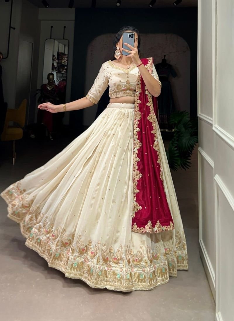 Exquisite thread embroidered silk lehenga in cream