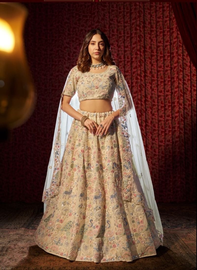 Stylish thread embroidered net lehenga choli in cream