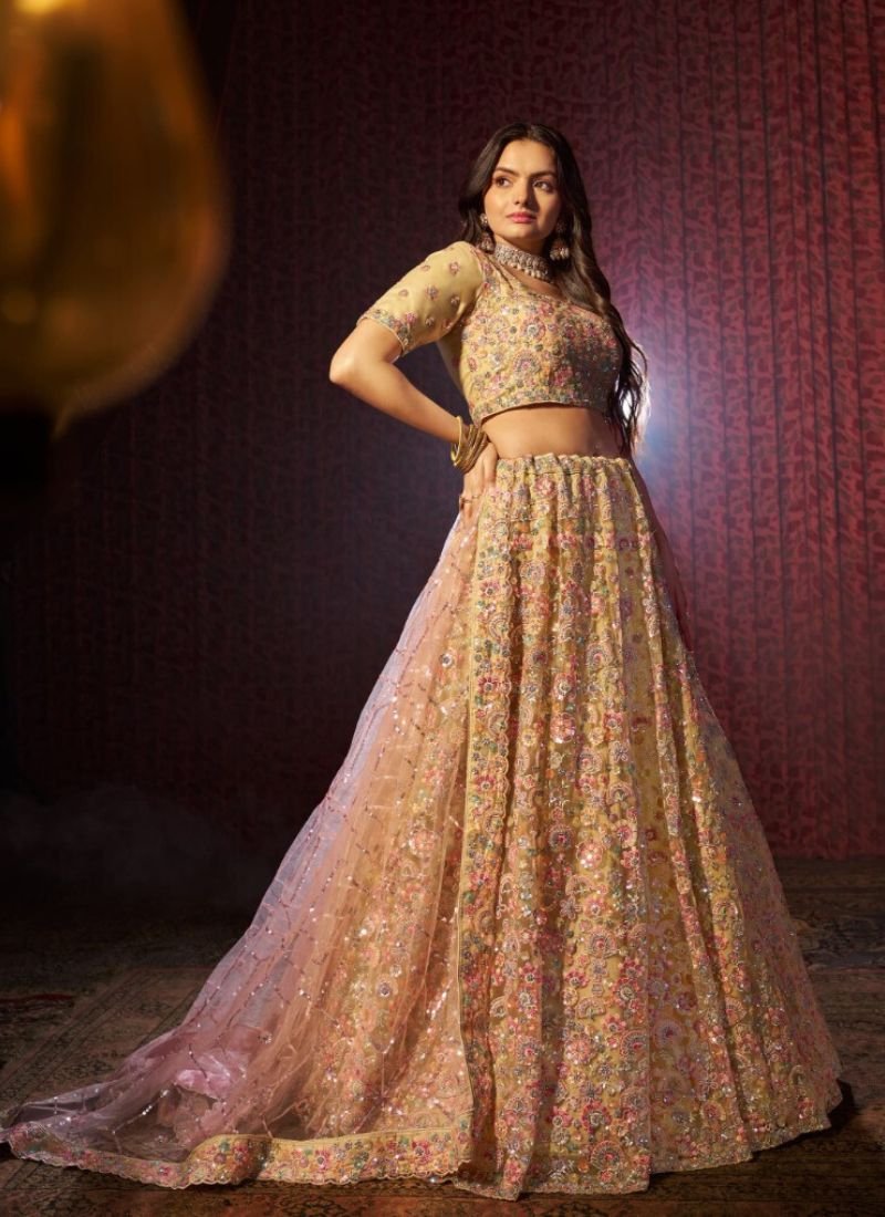 Stylish thread embroidered net lehenga choli in yellow