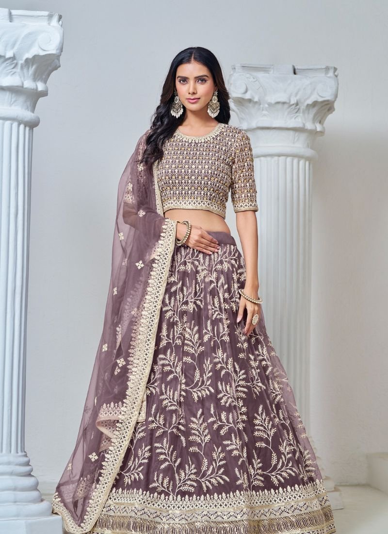 Exquisite heavy thread embroidered net lehenga choli in purple