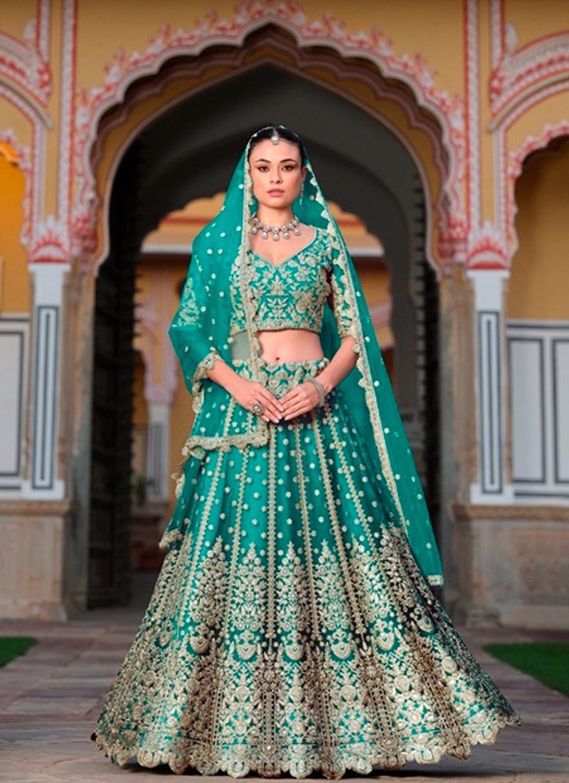 Beautiful bridal diamond embroidered butterfly net lehenga in dark green