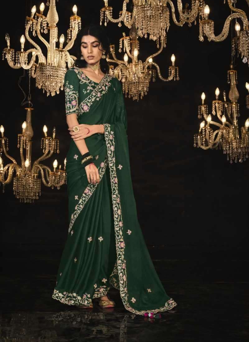 Pure silk saree with sequin, stone and zarkan work in Dark Green