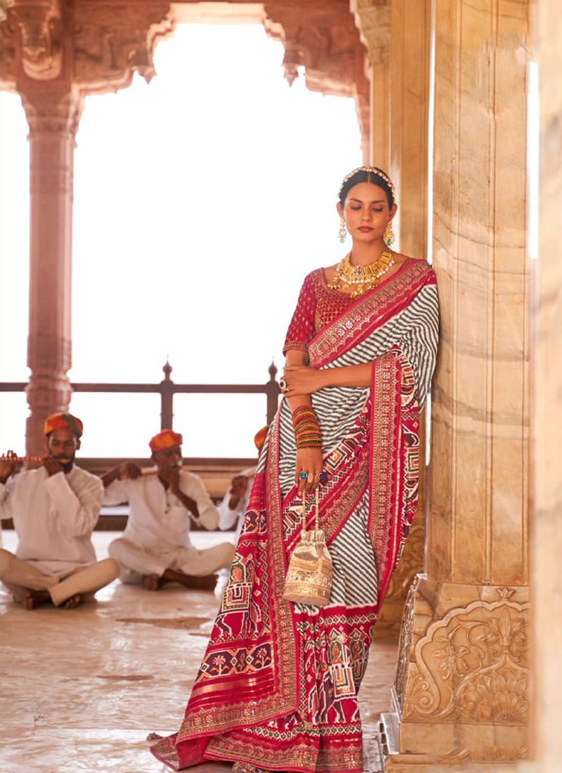 Traditional patola print saree with heavy embroidery in Pink