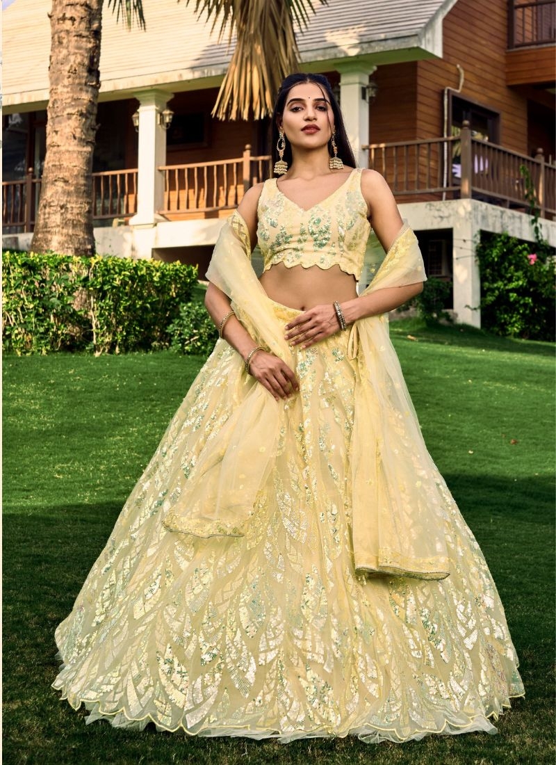 Heavy embroidered bridal lehenga in yellow