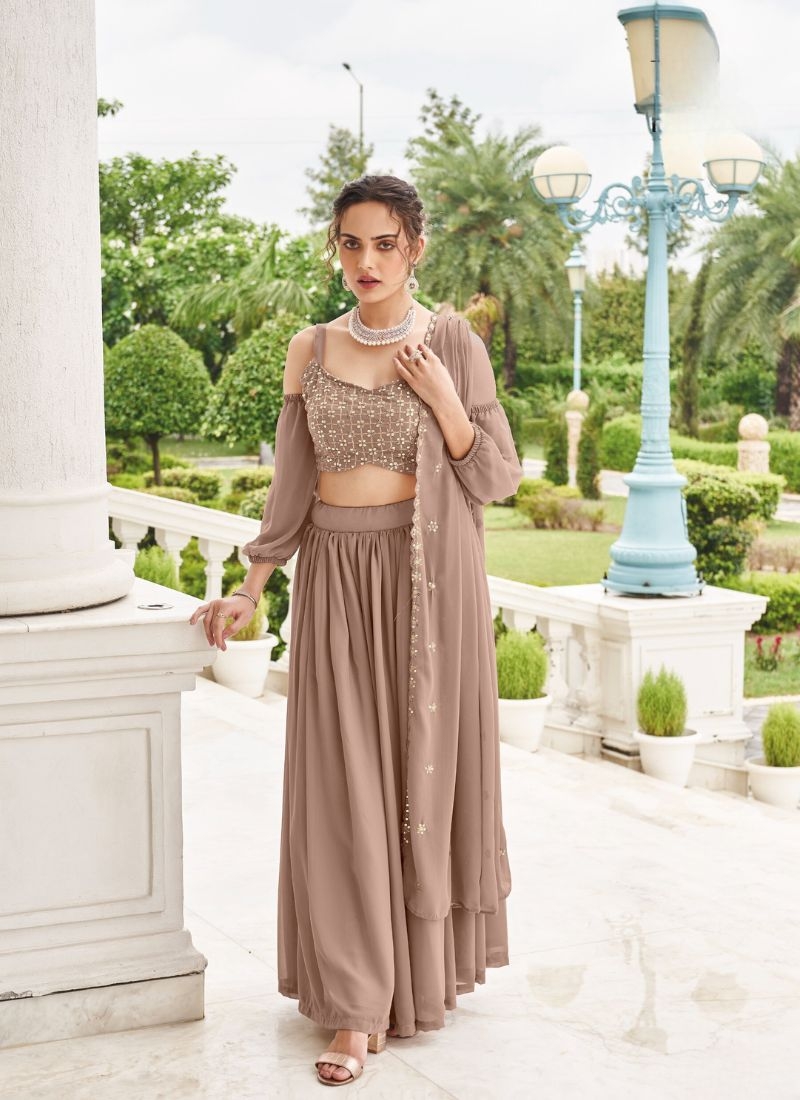 Trendy georgette lehenga with embroidered sleeve less blouse in beige