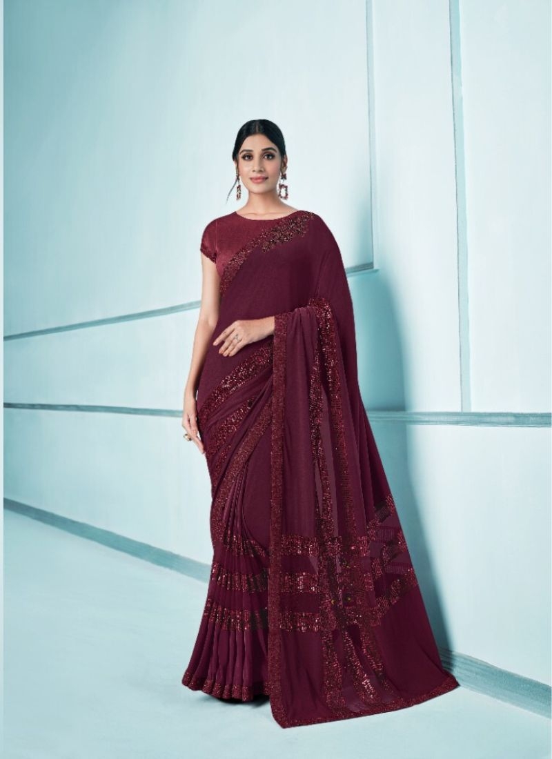 Exquisite wedding saree with embroidered blouse in maroon