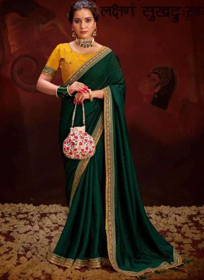 Trendy silk saree with beautifully embroidered blouse in dark green
