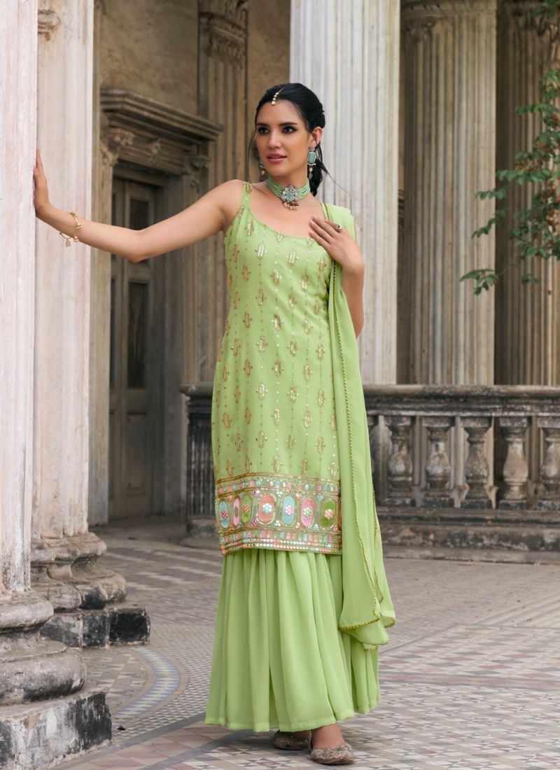 Exquisite heavy flare embroidered sharara suit in light green