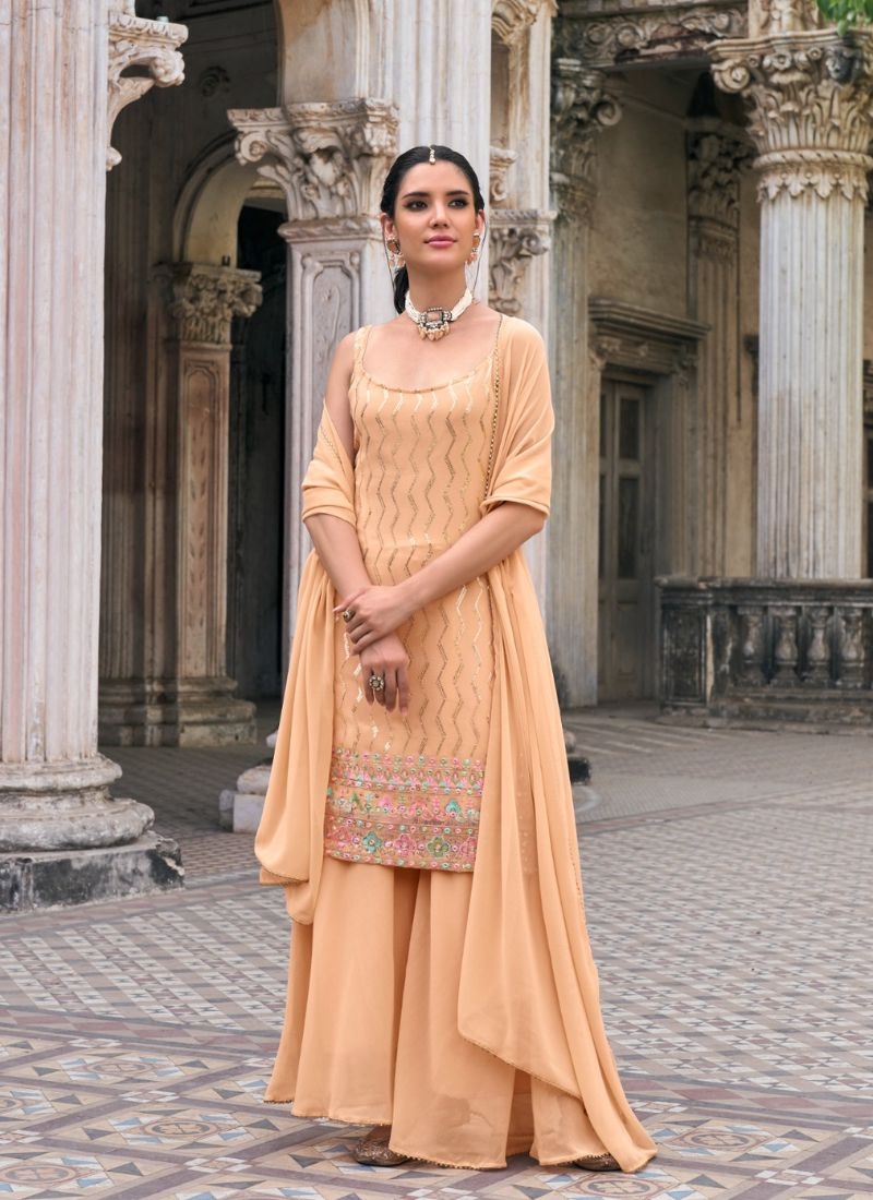 Exquisite heavy flare embroidered sharara suit in peach