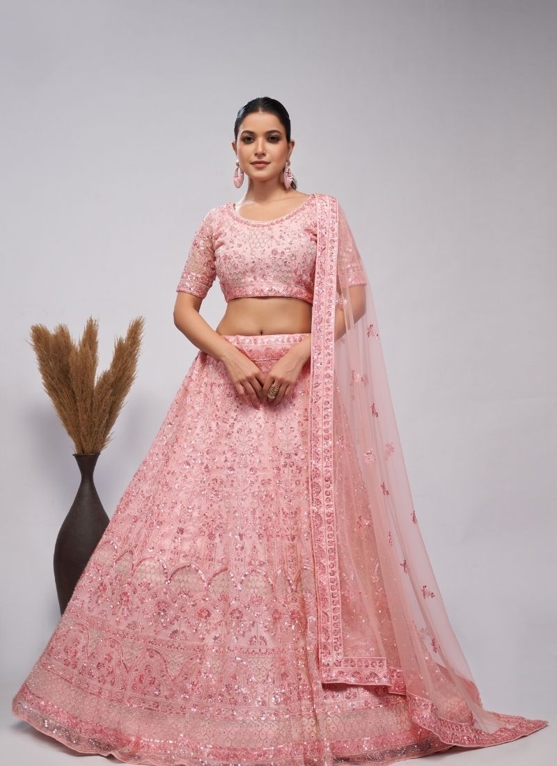 Stunning lehenga adorned by pearl and sequins bridal lehenga in peach