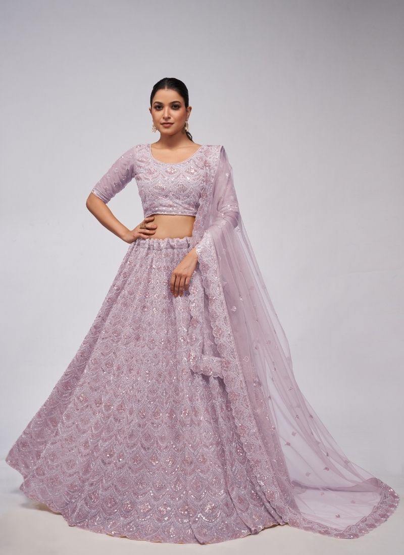 The dazzling lehenga is perfect for the contemporary bride. in purple