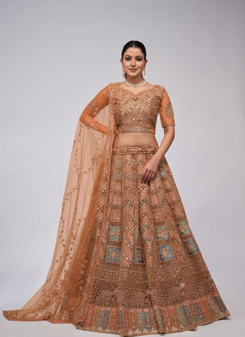 Beautiful patterns  zari embroidery in peacock and paisley motifs perfect bridal  lehenga in brown