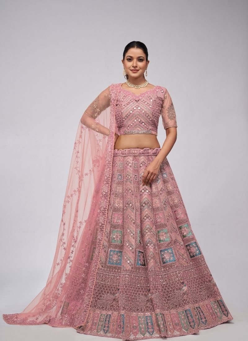 Beautiful patterns  zari embroidery in peacock and paisley motifs perfect bridal  lehenga in pink