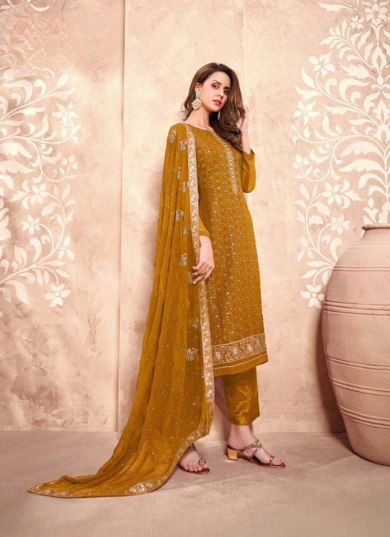 Beautiful embroidered georgette pant suit in mustard