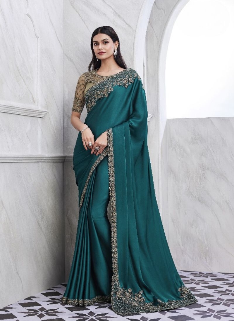 Exquisite embroidered silk saree in dark green