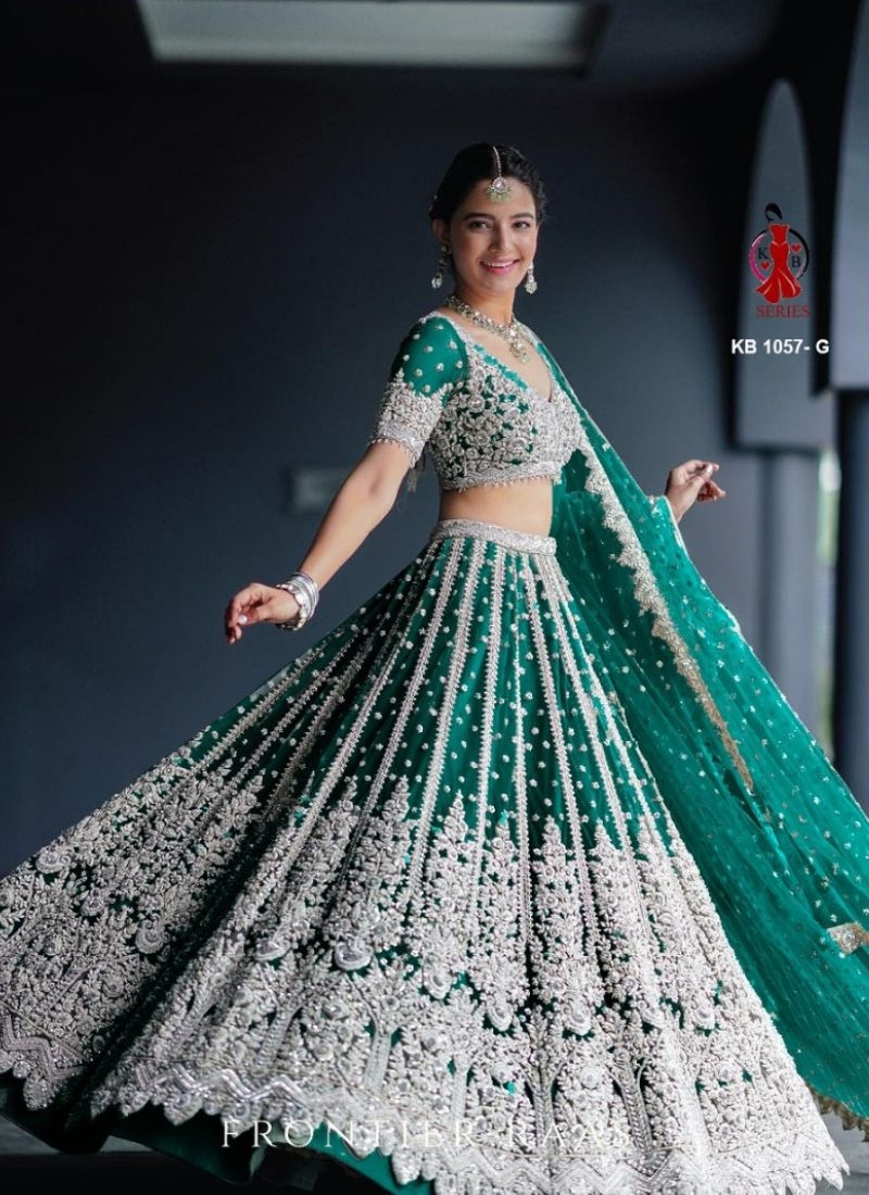 Beautiful embroidered butterfly net lehenga choli in dark green