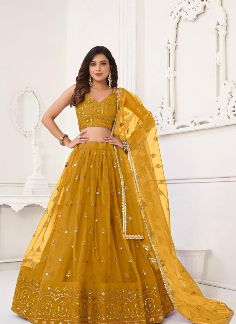 Stunning embroidered net lehenga choli in yellow