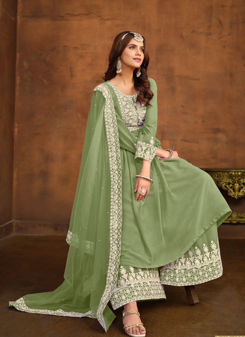 Beautiful embroidered faux georgette palazzo suit in green