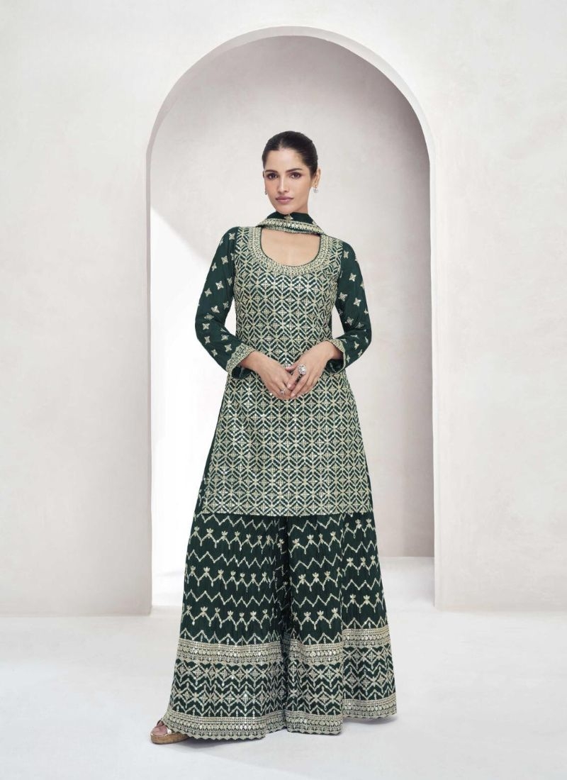 Exquisite thread embroidered sharara suit in dark green