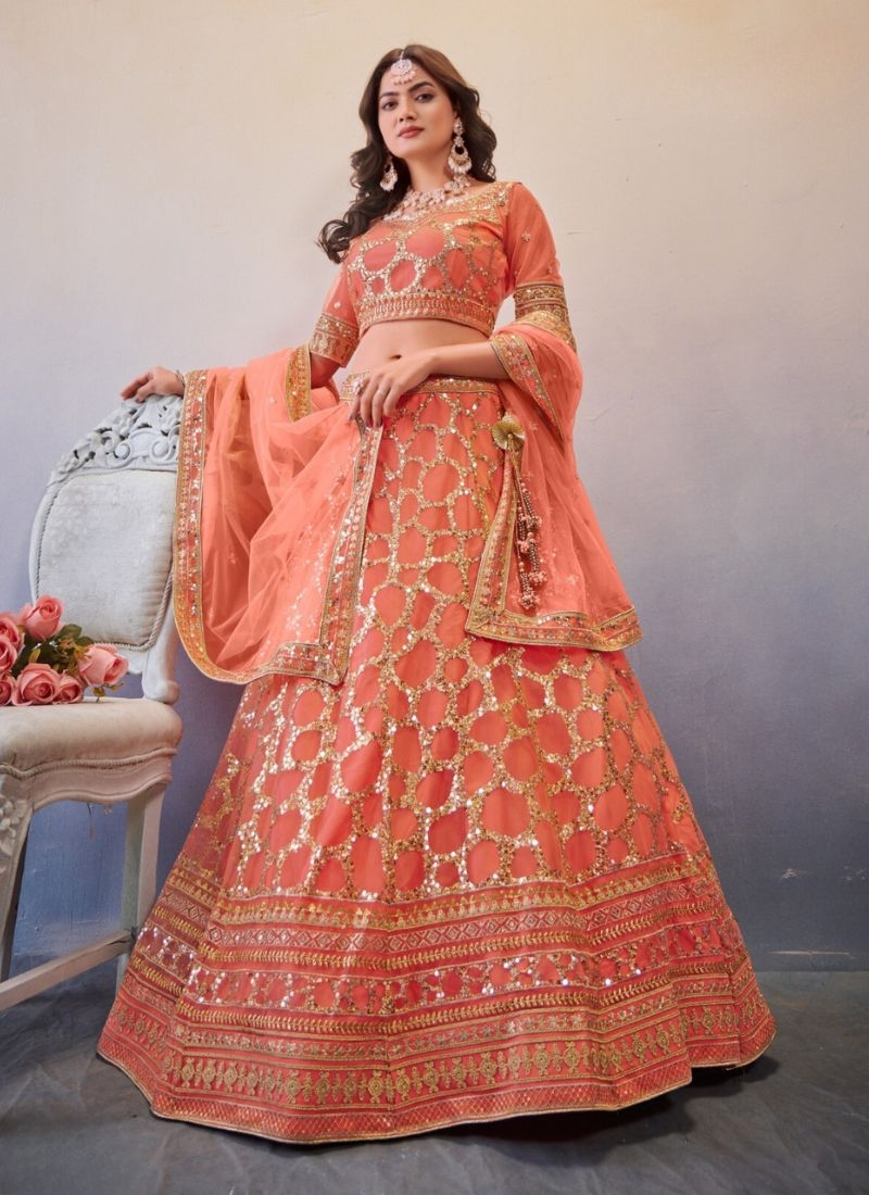 Exquisite thread embroidered net lehenga choli in orange