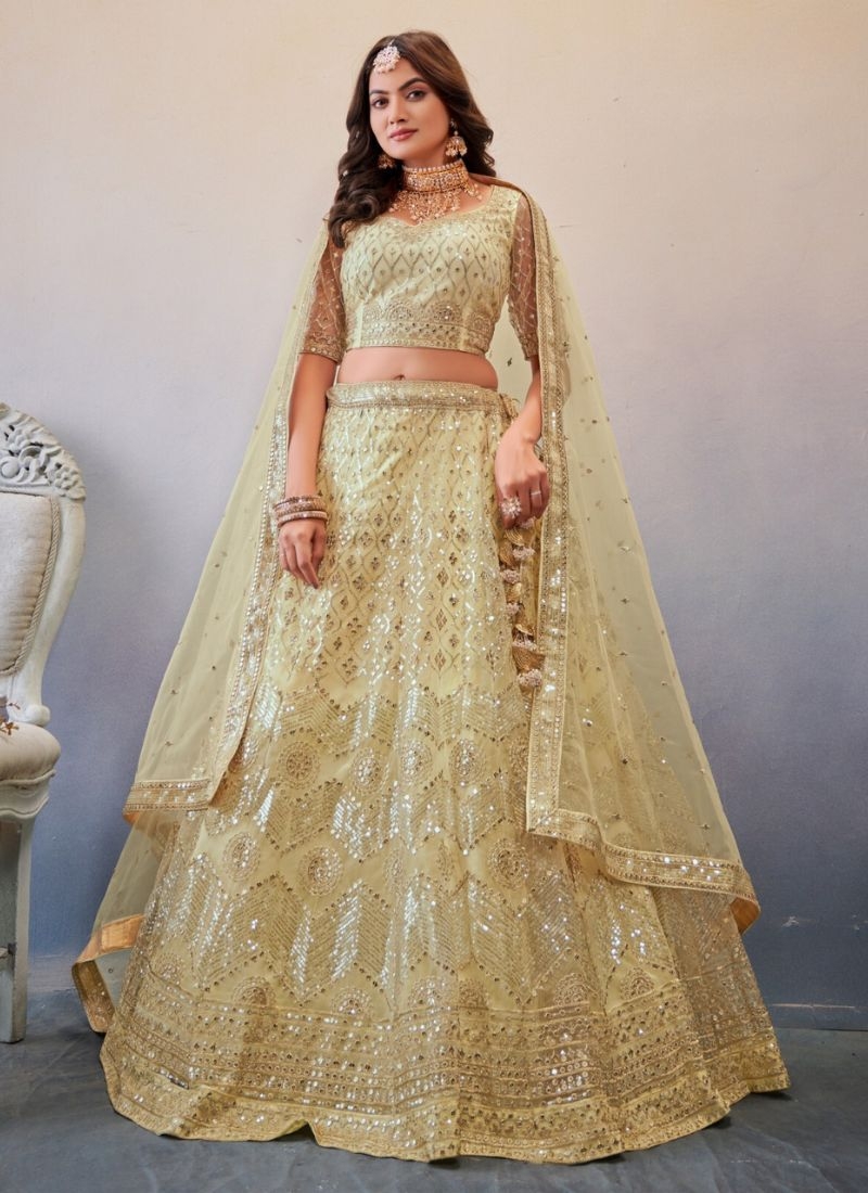 Exquisite thread embroidered net lehenga choli in cream