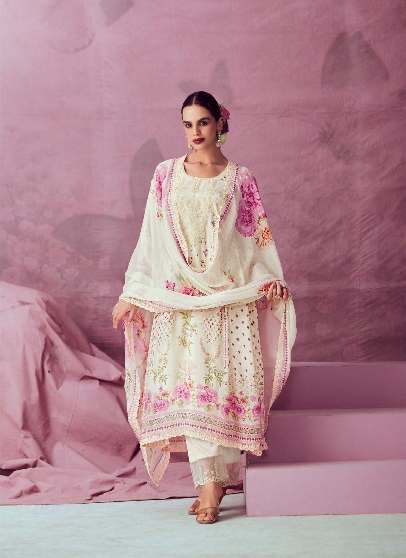 Beautiful embroidered pure muslin kurta pant suit in off white