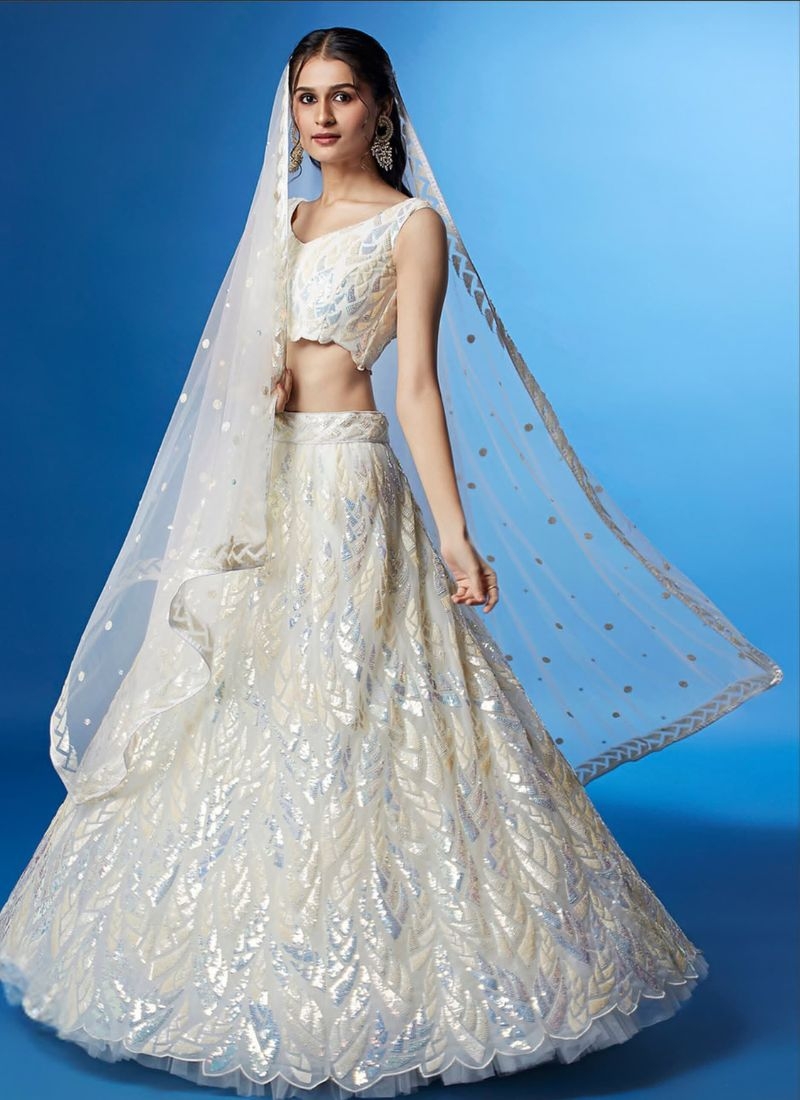 Exquisite multi-embroidered soft net lehenga choli in white