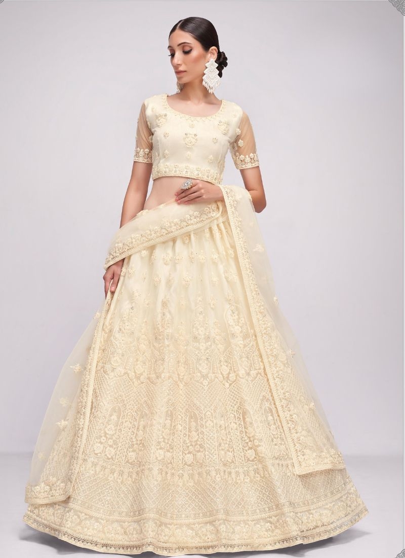 Designer stonework embroidered net lehenga choli in cream