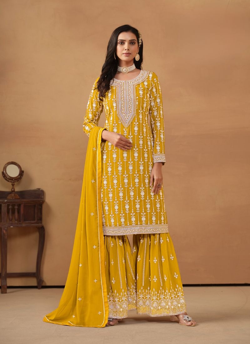 Stunning mirror embroidered faux georgette sharara suit in yellow