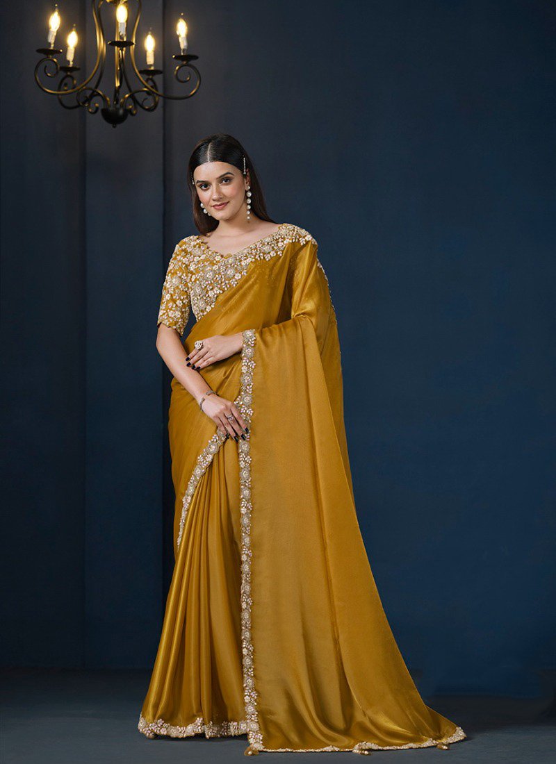 Exquisite hand embroidered silk saree in mustard