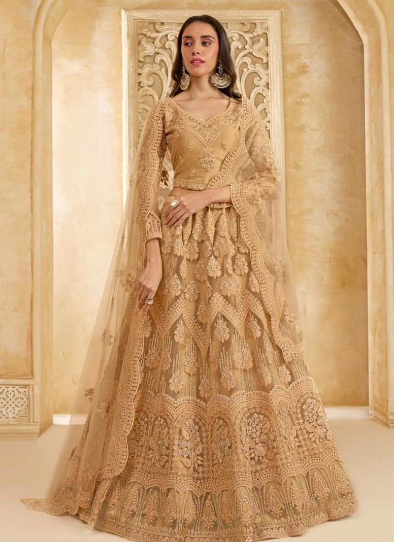 Trendy stone embroidered net lehenga in golden